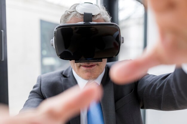 Businessman using VR goggles