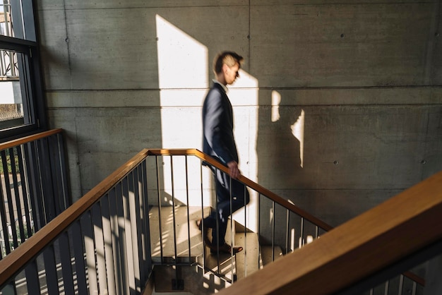 Businessman walking down stairs