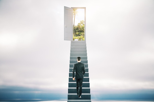 Businessman walking on ladder