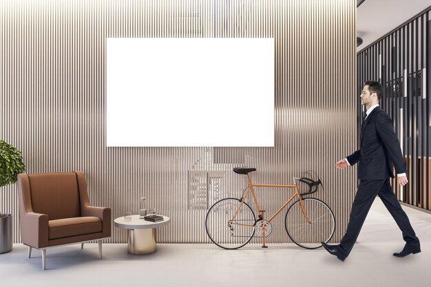 Businessman walking in modern office interior with empty poster and bike Mock up