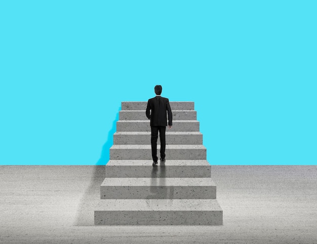Businessman walking up stairs for design