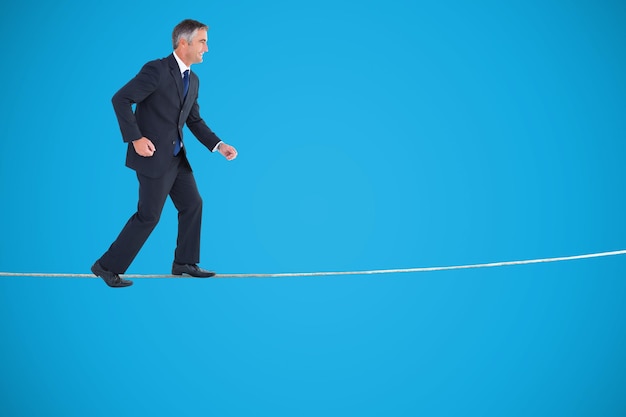 Photo businessman walking on white background against blue background