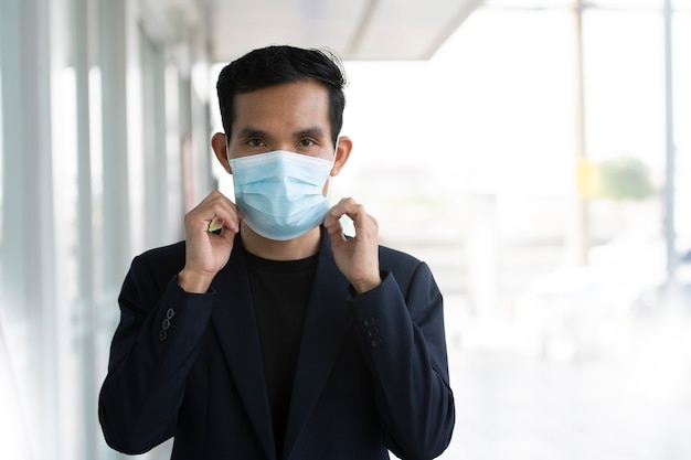 Businessman wear face mask protect coronavirus covid19