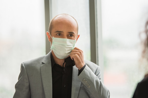 Businessman wear mask protect coronavirus covid19 in  office