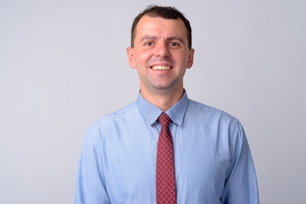 businessman wearing shirt and tie on white