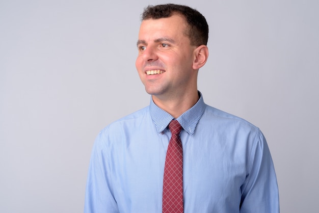 businessman wearing shirt and tie on white