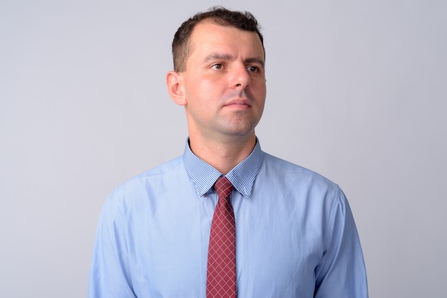 businessman wearing shirt and tie on white