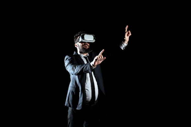 Businessman wearing virtual reality headset gesturing and\
taking professional training through simulator man in suit\
presenting modern technology of innovative learning
