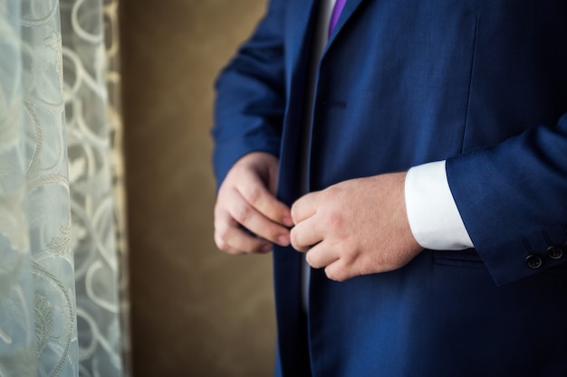 Businessman wears a jacket.Politician, man's style,male hands closeup, ,  businessman, business, fashion and clothing concept