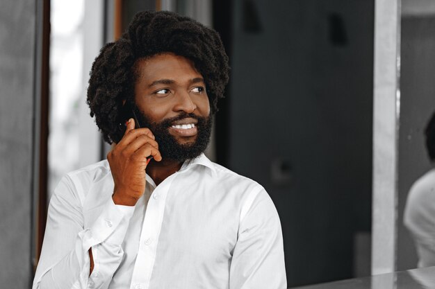 businessman in white shirt talking on the phone