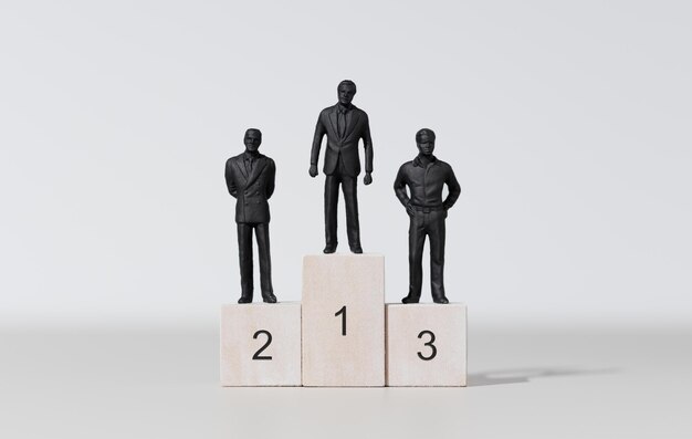 Businessman winner concept Three businessman on podium