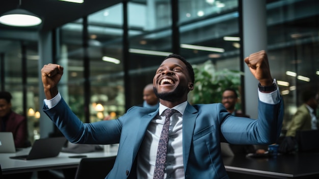 Businessman with arms raised