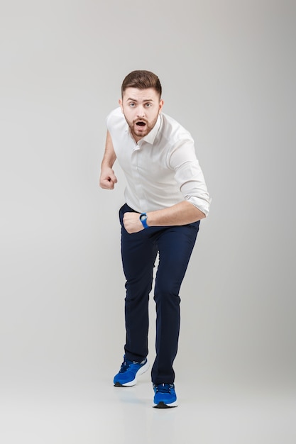 Businessman with beard in white shirt on position