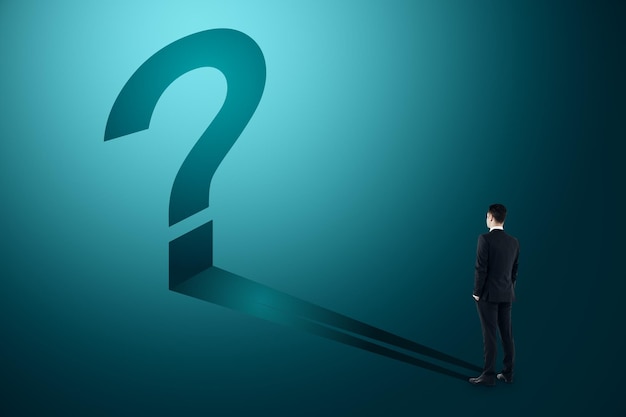 businessman with blue question mark