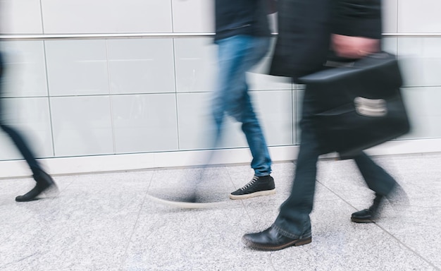 Businessman with briefcase rushing in a corridor