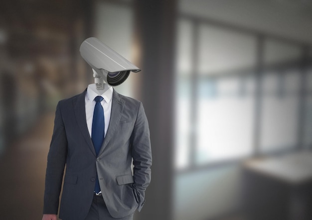 Businessman with CCTV head at office