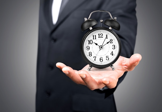 Photo businessman with clock in time concept on background