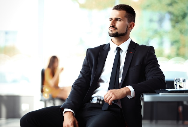 Businessman with colleagues in the background