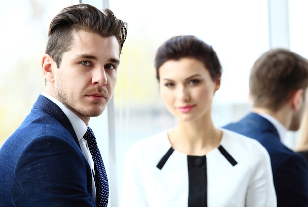 Businessman with colleagues in the background