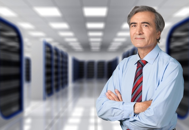 Businessman with crossed hands in office