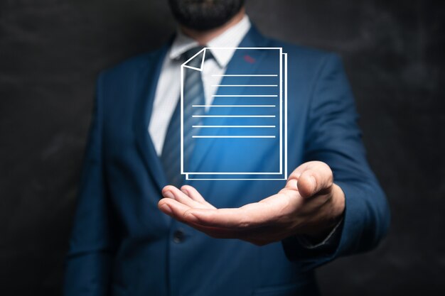 Businessman with empty hand on dark background