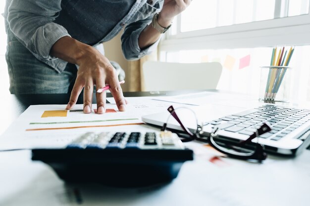 Businessman with financial documents working on a desk