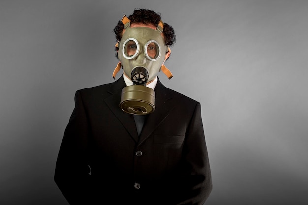 Businessman with gas mask, concept business dangerous for the environment or for society