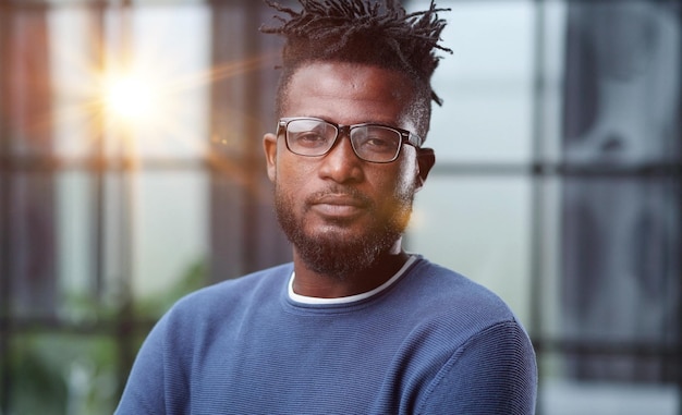 Businessman with glasses dressed in blue casual clothes