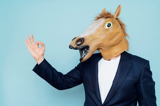 businessman with horse mask