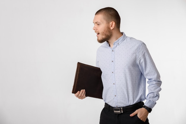 Businessman with leather case on white background