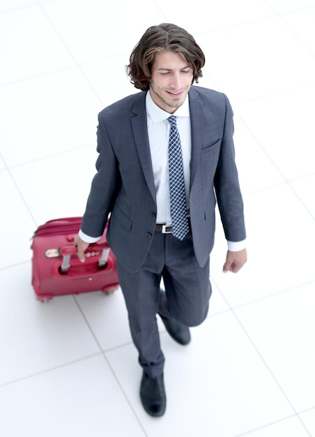 Businessman with Luggage isolated on white