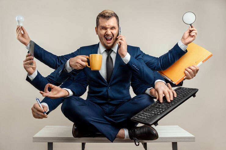 Photo businessman with many hands in a suit works simultaneously with several objects