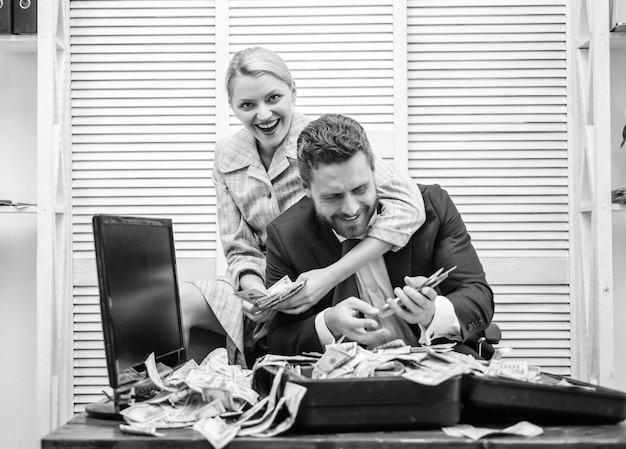 Businessman with money on office room money in business falling\
pennies