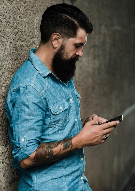 Businessman with smart phone on street man with phone in the city business male