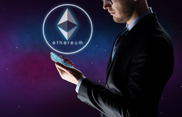 Photo businessman with smartphone and ethereum hologram