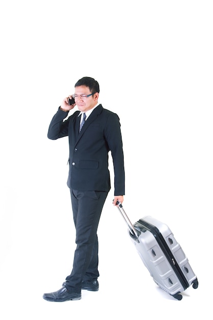 Businessman with a suitcase isolated on white background