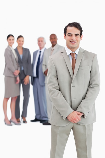 Businessman with team behind him