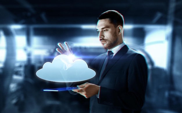 businessman with transparent tablet and cloud