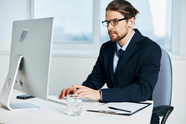 Businessman work in front of a computer documents Lifestyle