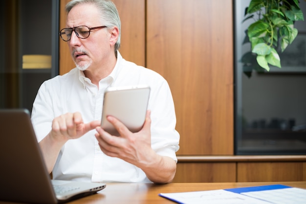 Businessman at work in his office