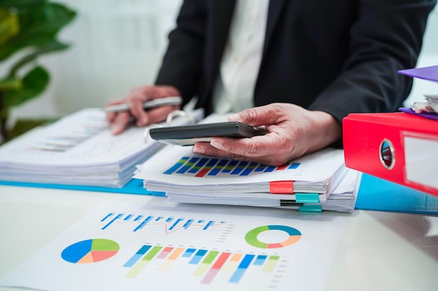 Businessman working and analysis with statistic graph in office