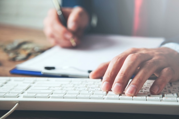 Businessman working at computer and document