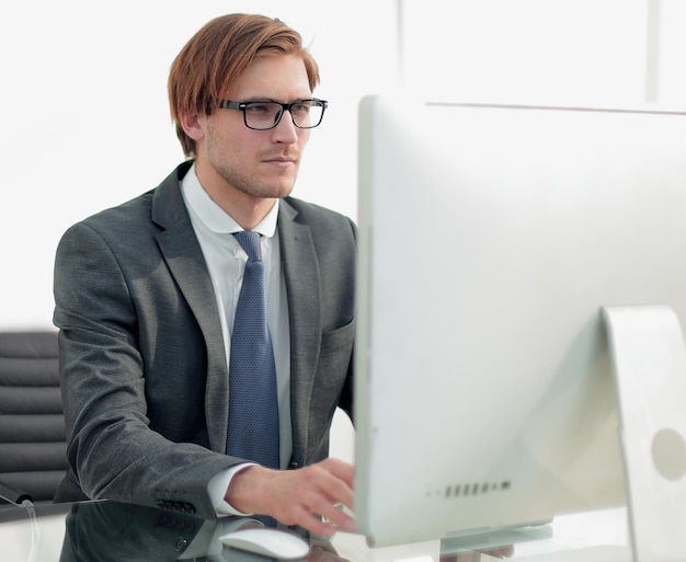 Businessman working on a computer in a modern office.photo with copy space