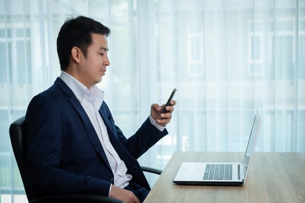 Businessman working at the desk in the office