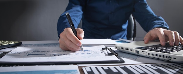 Businessman working in financial graphs