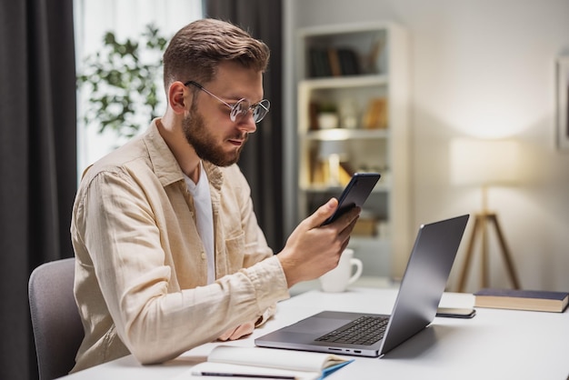 Businessman working from home checking messages