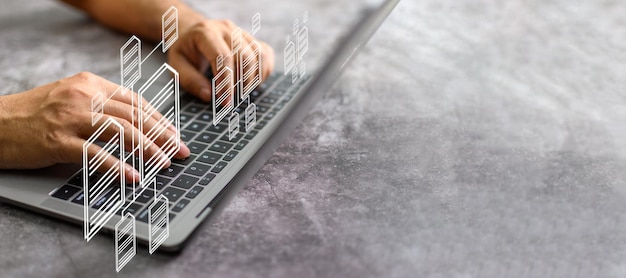 Businessman working from home using laptop with virtual screen Process data and manage files on Internet efficiently Online document database system and electronic document management system concept