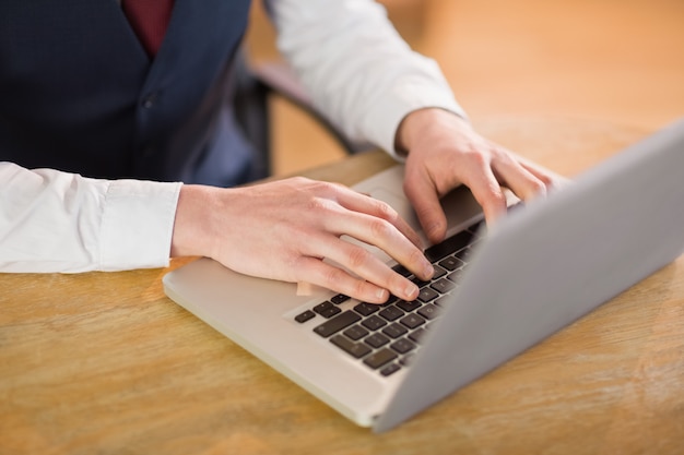 Businessman working on his laptop in his office