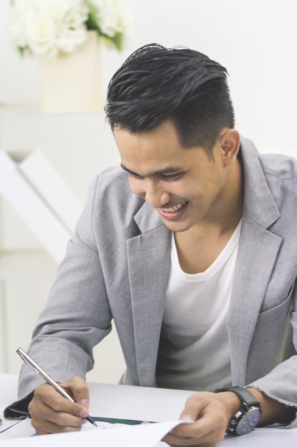 Businessman working on his paperwork in the office