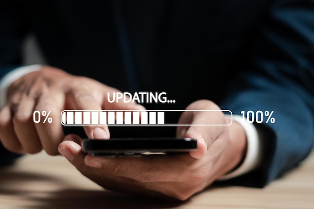 businessman working and installing update process software updates or operating system upgrades to keep your device up to date with enhanced functionality in new versions and improved security